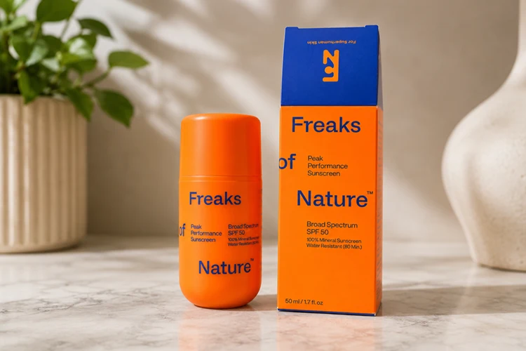 bright orange bottle packaging of freaks of nature peak performance spf 50 sunscreen