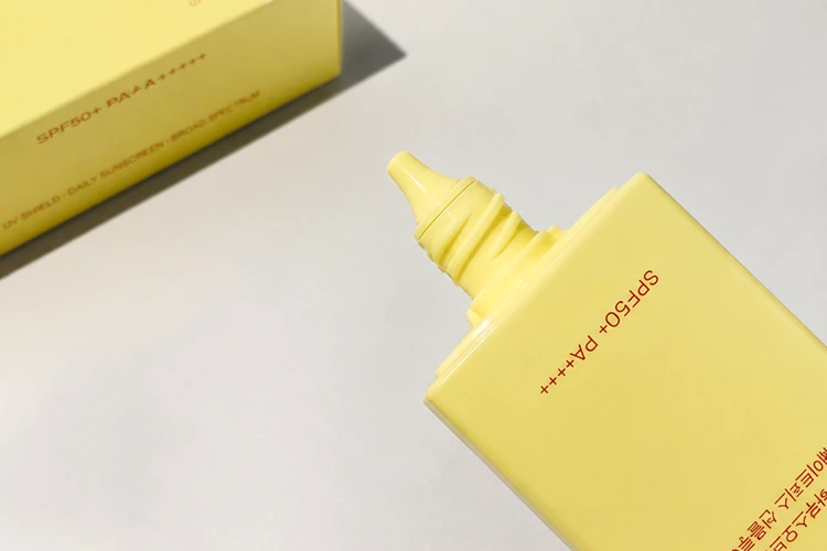 slim precision nozzle of house of hur weightless sun fluid squeeze bottle